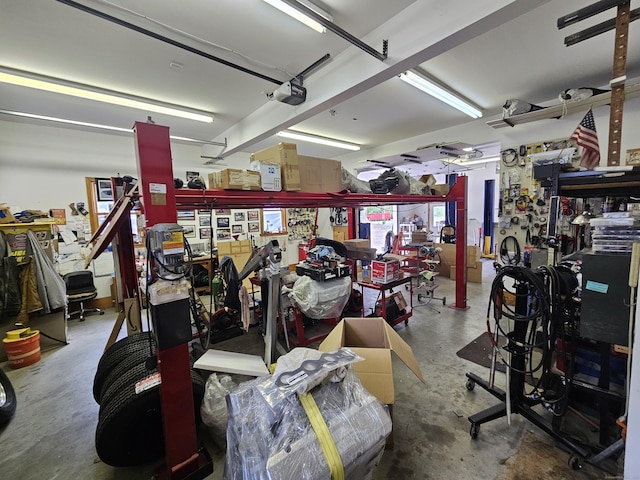 69 Elmdale Rd, Canterbury, CT 06331 - garage featuring a workshop area and a garage door opener