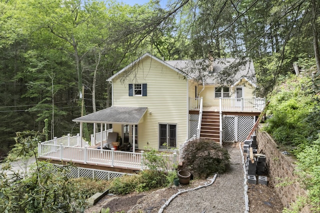 18 Brookside Trl, Monroe, CT 06468 - back of house with roof with shingles, stairs, and a wooden deck