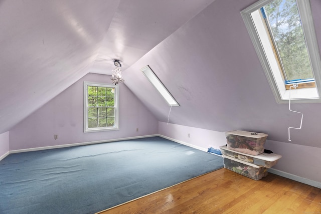 18 Brookside Trl, Monroe, CT 06468 - bonus room with a skylight, baseboards, vaulted ceiling, and wood finished floors