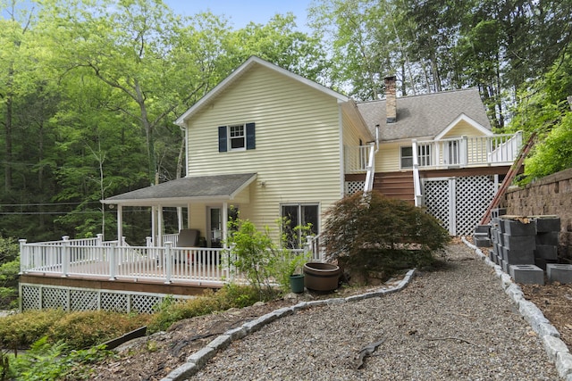 18 Brookside Trl, Monroe, CT 06468 - rear view of house featuring a wooden deck, a chimney, and stairs