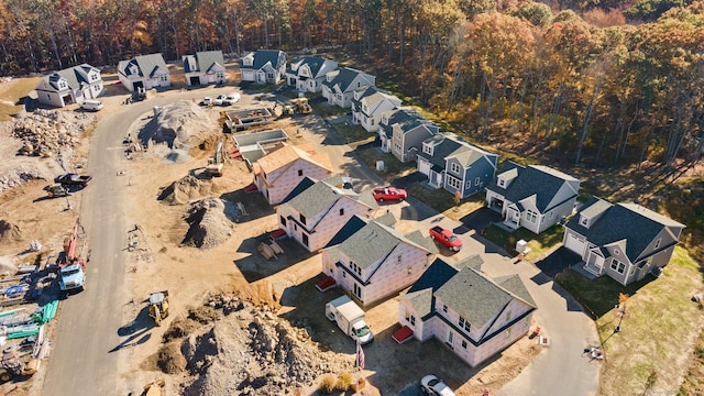 aerial view featuring a forest view and a residential view