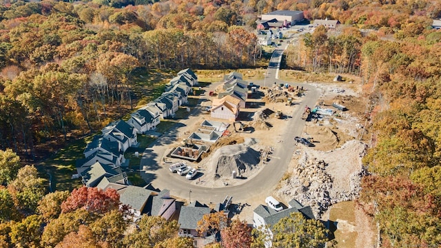 bird's eye view featuring a wooded view
