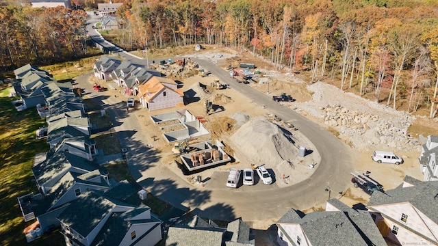 birds eye view of property with a view of trees