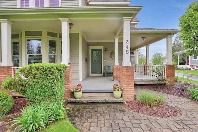 doorway to property with a porch