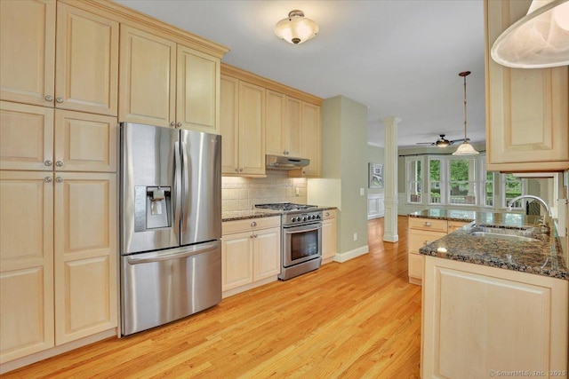 kitchen featuring stainless steel appliances, ceiling fan, backsplash, under cabinet range hood, and light wood-style floors