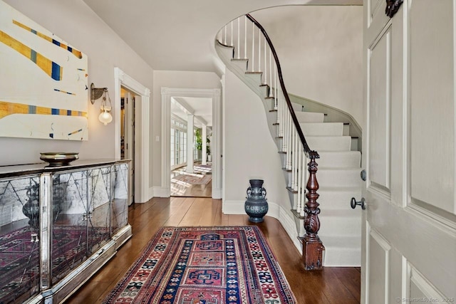 3113 Bronson Rd, Fairfield, CT 06824 - entryway featuring stairway, wood finished floors, and baseboards