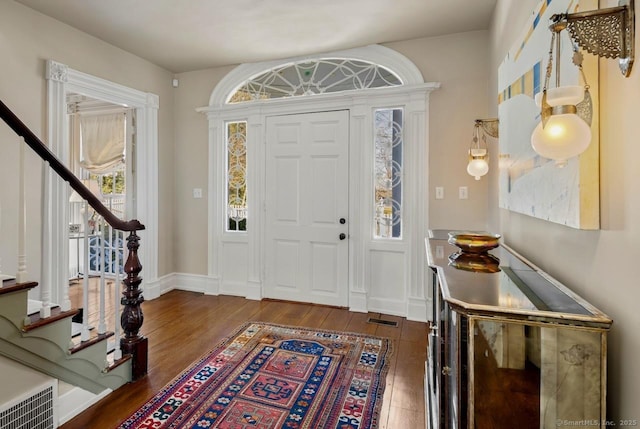 3113 Bronson Rd, Fairfield, CT 06824 - entryway with hardwood / wood-style flooring, stairs, and baseboards