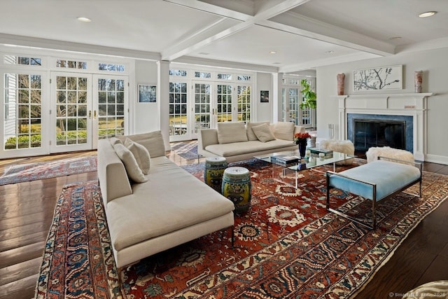 3113 Bronson Rd, Fairfield, CT 06824 - living area with french doors, beam ceiling, wood finished floors, a glass covered fireplace, and recessed lighting