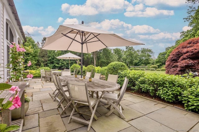 3113 Bronson Rd, Fairfield, CT 06824 - view of patio featuring outdoor dining space and view of scattered trees