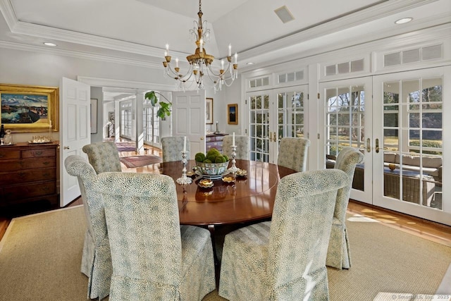 3113 Bronson Rd, Fairfield, CT 06824 - dining space featuring french doors, ornamental molding, a chandelier, plenty of natural light, and recessed lighting