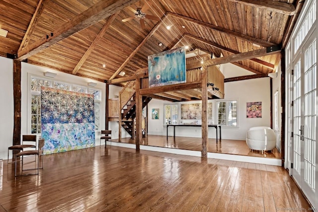 3113 Bronson Rd, Fairfield, CT 06824 - unfurnished living room featuring stairway, high vaulted ceiling, hardwood / wood-style flooring, wooden ceiling, and beamed ceiling
