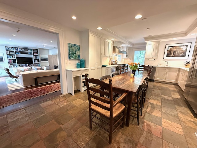 3113 Bronson Rd, Fairfield, CT 06824 - dining space featuring stone tile flooring, recessed lighting, and crown molding