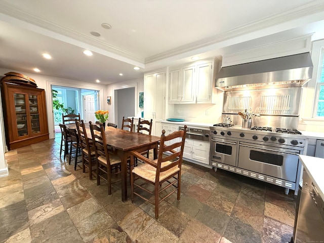 3113 Bronson Rd, Fairfield, CT 06824 - kitchen with wall chimney exhaust hood, double oven range, stone tile floors, ornamental molding, and recessed lighting