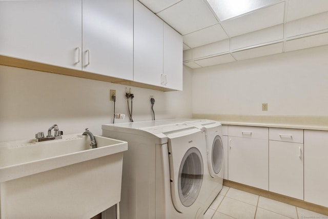 9 Brick School Dr, Redding, CT 06896 - laundry area featuring cabinet space, washing machine and dryer, and light tile patterned floors