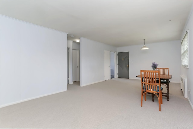 36 Courtland Ave Unit 3, Stamford, CT 06902 - dining room with radiator heating unit, light colored carpet, and baseboards