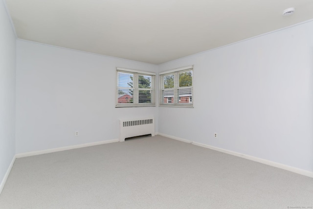 36 Courtland Ave Unit 3, Stamford, CT 06902 - spare room featuring radiator, light carpet, baseboards, and a smoke detector