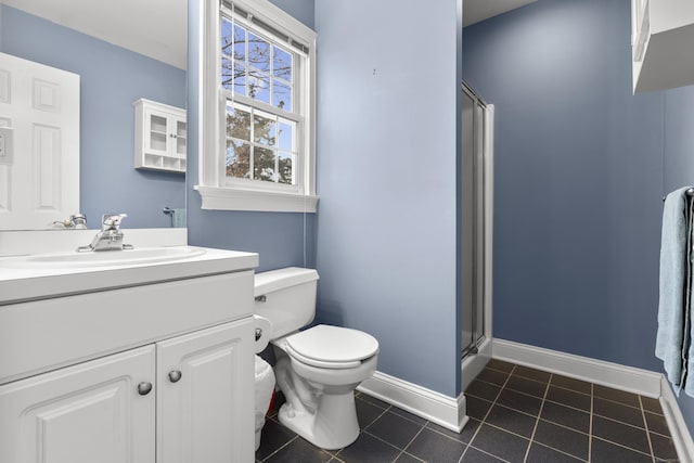 full bath with toilet, vanity, tile patterned flooring, a shower stall, and baseboards
