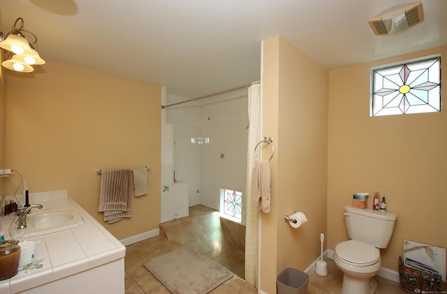231 Lake Shore Dr, East Haddam, CT 06415 - bathroom with a shower with curtain, baseboards, toilet, tile patterned flooring, and vanity