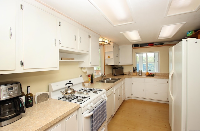 231 Lake Shore Dr, East Haddam, CT 06415 - kitchen with white appliances, a sink, light wood-type flooring, white cabinetry, and light countertops