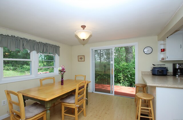 231 Lake Shore Dr, East Haddam, CT 06415 - dining area with light wood-style flooring and plenty of natural light