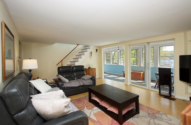 231 Lake Shore Dr, East Haddam, CT 06415 - living room with stairway and light wood-style flooring