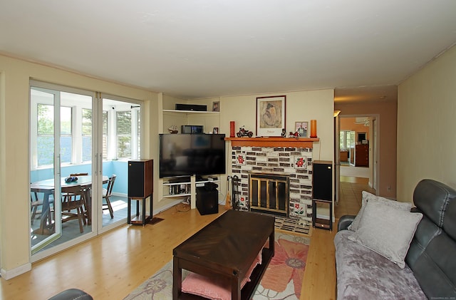 231 Lake Shore Dr, East Haddam, CT 06415 - living room featuring wood finished floors, plenty of natural light, and a stone fireplace