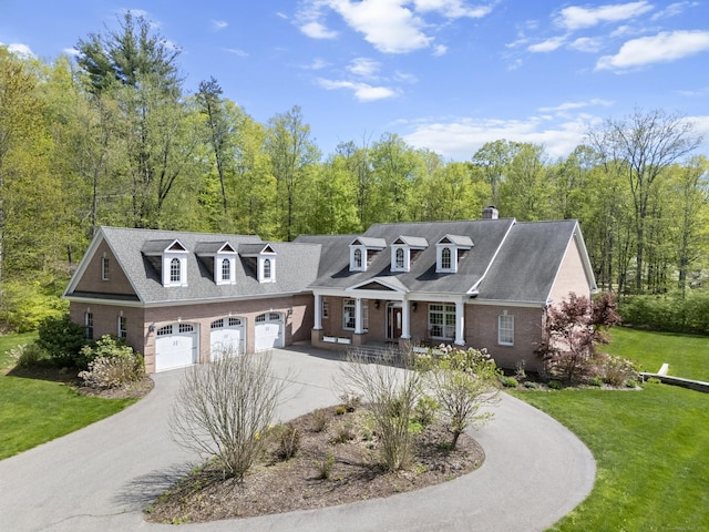15 Hickory Hill Rd, Avon, CT 06001 - view of front of home featuring a garage, a chimney, aphalt driveway, a front yard, and brick siding
