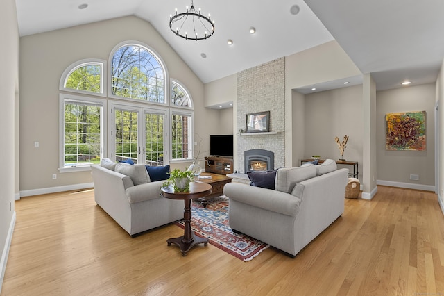 15 Hickory Hill Rd, Avon, CT 06001 - living room featuring a large fireplace, baseboards, light wood-type flooring, and plenty of natural light
