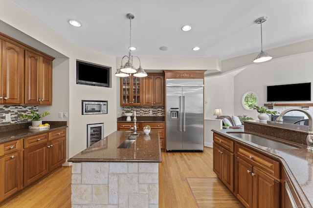 15 Hickory Hill Rd, Avon, CT 06001 - kitchen with a sink, brown cabinets, decorative backsplash, and stainless steel built in fridge
