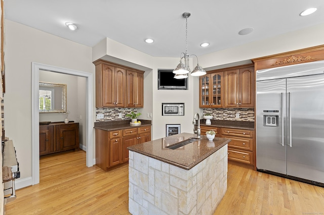 15 Hickory Hill Rd, Avon, CT 06001 - kitchen with light wood-type flooring, built in fridge, tasteful backsplash, and a sink