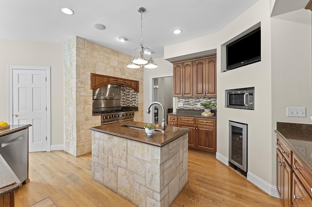 15 Hickory Hill Rd, Avon, CT 06001 - kitchen with wine cooler, light wood-style floors, a sink, and baseboards