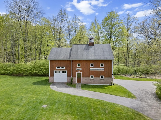 15 Hickory Hill Rd, Avon, CT 06001 - view of side of property featuring a yard, aphalt driveway, a garage, and a chimney