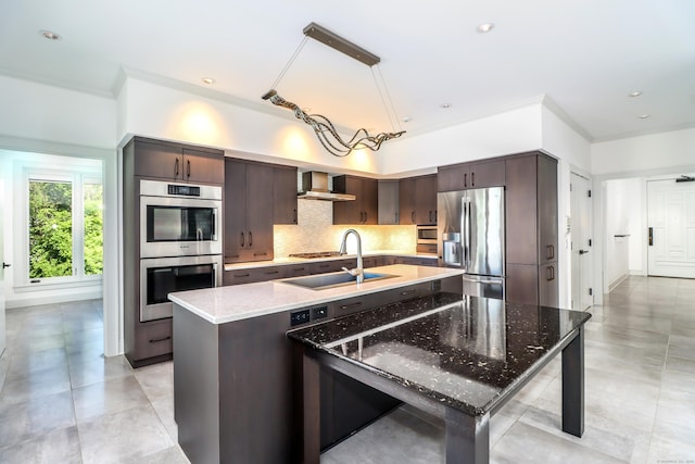13 Kellogg St, Brookfield, CT 06804 - kitchen featuring appliances with stainless steel finishes, a sink, wall chimney exhaust hood, dark brown cabinets, and decorative backsplash