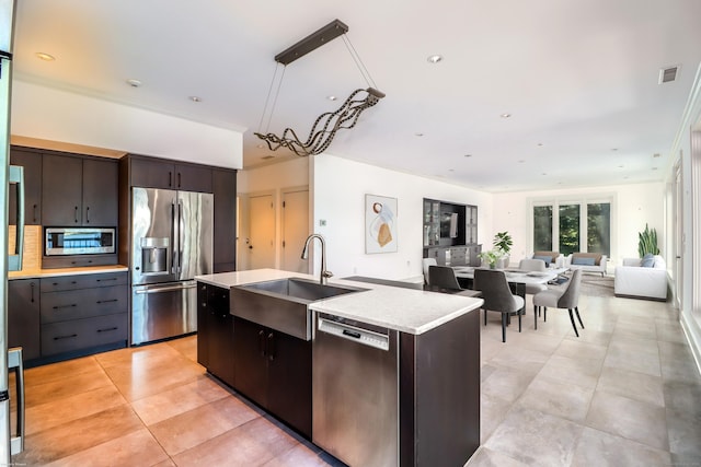 13 Kellogg St, Brookfield, CT 06804 - kitchen featuring appliances with stainless steel finishes, a sink, light countertops, light tile patterned floors, and open floor plan