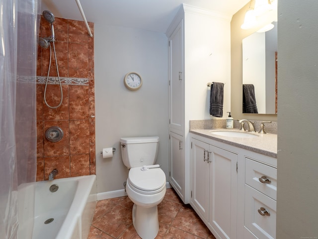 full bathroom with toilet, vanity, tile patterned flooring,  shower combination, and baseboards