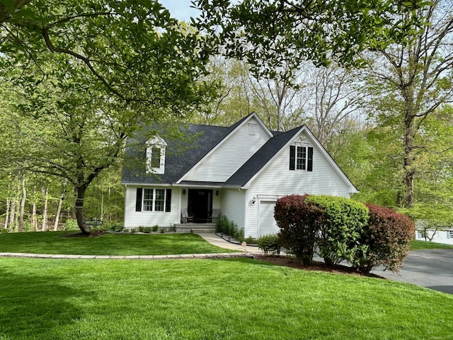 92 Sherwood Ln, Norwich, CT 06360 - traditional-style home with a front yard, roof with shingles, and a garage