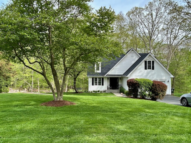 92 Sherwood Ln, Norwich, CT 06360 - view of front of home featuring a front lawn, a garage, and driveway