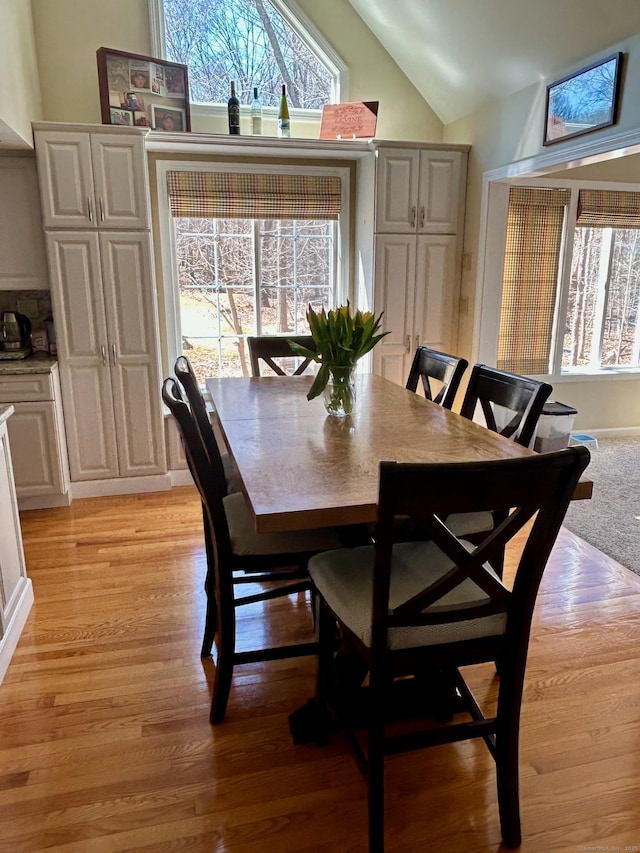 92 Sherwood Ln, Norwich, CT 06360 - dining room featuring lofted ceiling and light wood-style floors