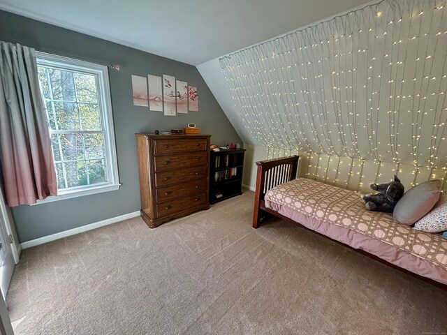 92 Sherwood Ln, Norwich, CT 06360 - bedroom featuring baseboards, light colored carpet, and vaulted ceiling