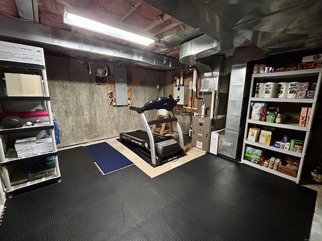 92 Sherwood Ln, Norwich, CT 06360 - workout room featuring electric panel, heating unit, and water heater