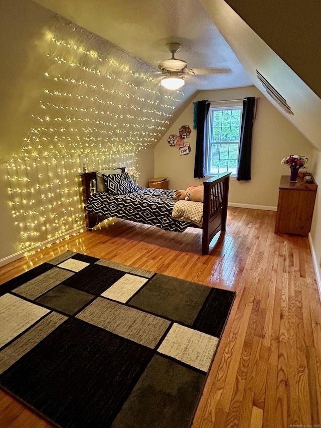 92 Sherwood Ln, Norwich, CT 06360 - bedroom with wood finished floors, lofted ceiling, and baseboards