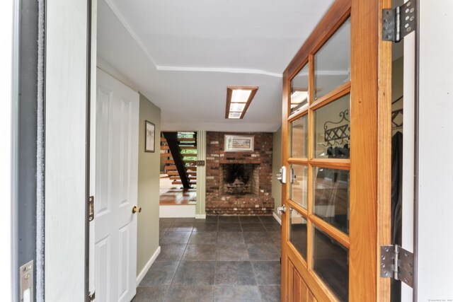 27 Whippoorwill Ln, Bethany, CT 06524 - entrance foyer with a brick fireplace and baseboards