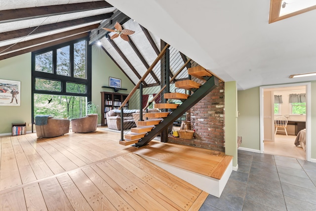 27 Whippoorwill Ln, Bethany, CT 06524 - staircase featuring beam ceiling, high vaulted ceiling, a ceiling fan, and baseboards