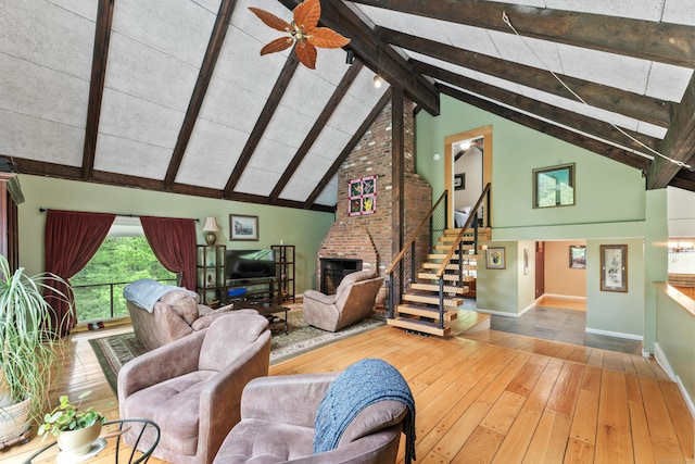 27 Whippoorwill Ln, Bethany, CT 06524 - living room with a brick fireplace, beamed ceiling, baseboards, hardwood / wood-style floors, and high vaulted ceiling
