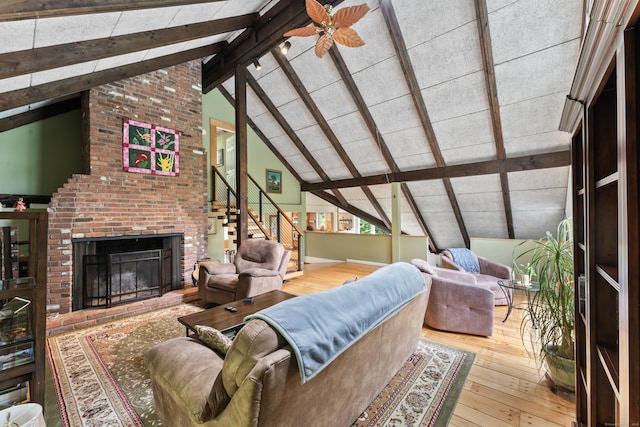 27 Whippoorwill Ln, Bethany, CT 06524 - living area with hardwood / wood-style flooring, a brick fireplace, and stairs