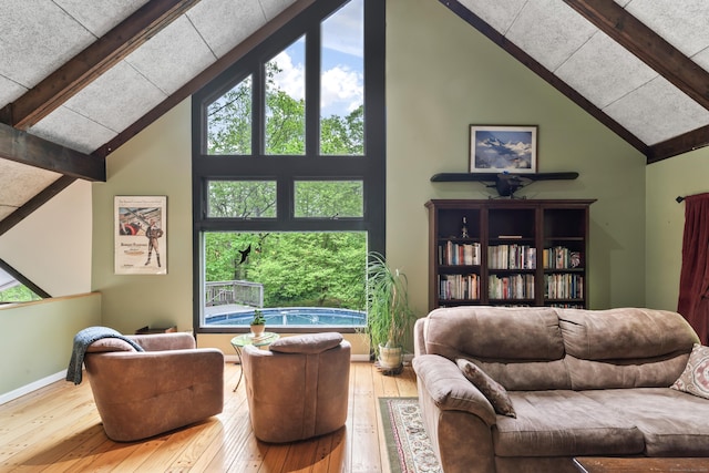 27 Whippoorwill Ln, Bethany, CT 06524 - living area featuring hardwood / wood-style flooring, beamed ceiling, baseboards, and high vaulted ceiling