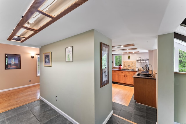 27 Whippoorwill Ln, Bethany, CT 06524 - hallway with a sink, baseboards, and dark tile patterned flooring