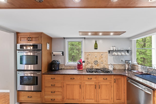27 Whippoorwill Ln, Bethany, CT 06524 - kitchen with appliances with stainless steel finishes, plenty of natural light, brown cabinetry, and recessed lighting