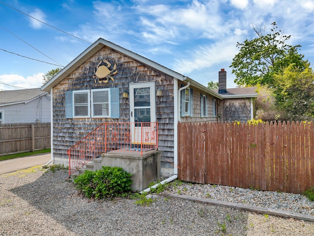 49 Hartford Ave, Old Saybrook, CT 06475 - view of front of property with fence and a chimney