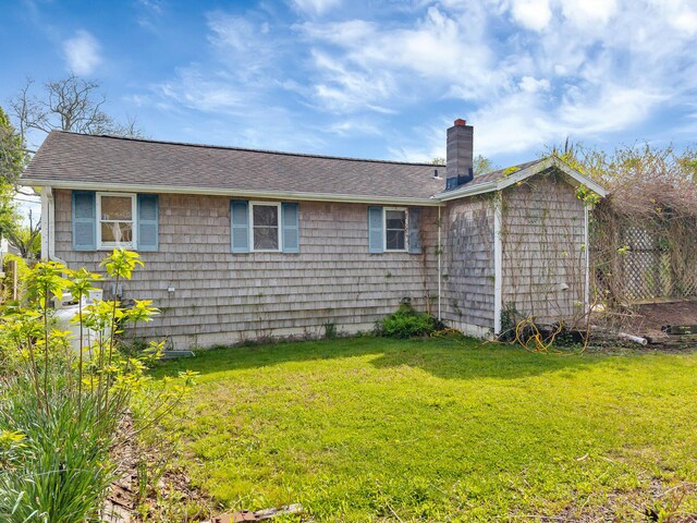 49 Hartford Ave, Old Saybrook, CT 06475 - back of property with a chimney, roof with shingles, and a yard